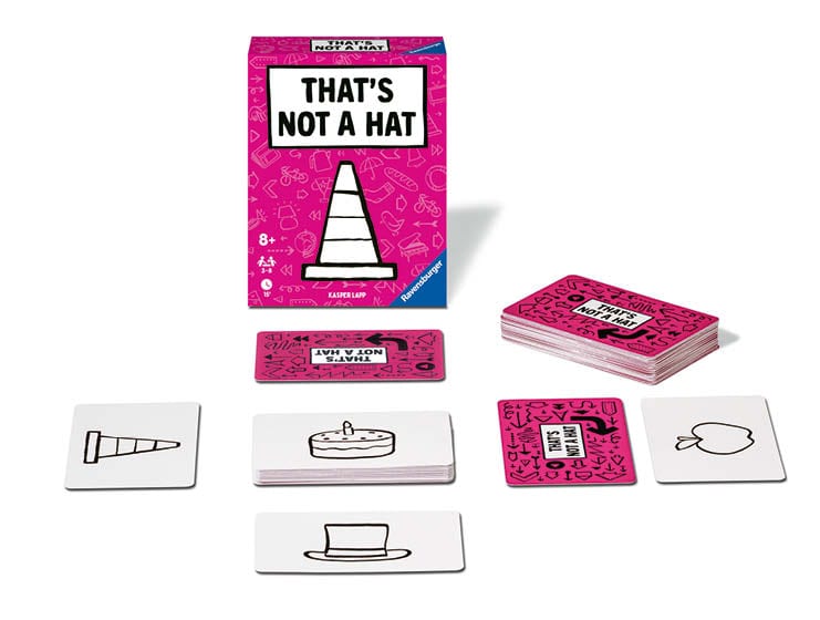 Pinkes Ravensburger Kartenspiel THAT`S NOT A HAT mit Symbolkarten, Stapel und bedruckter Karte mit schwarzem Hut-Icon auf weißem Hintergrund.